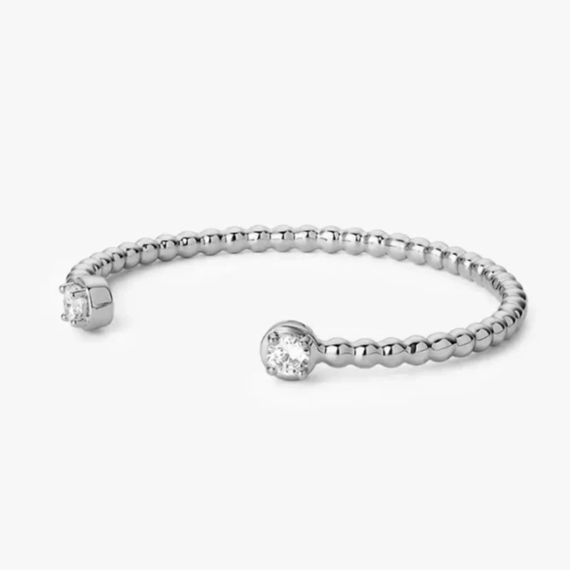 Buying a silver bracelet with Moissanite stone - a luxurious and lasting choice Are you looking for a bracelet with a stylish design and a special and sparkling stone? Our silver bracelets are designed using Moissanite, one of the most brilliant and special gemstones. Every silver bracelet offered in our store offers you a combination of beauty and quality. Moissanite is a synthetic gemstone known for its exceptional brilliance and clarity, making it an excellent alternative to diamonds. The combination of this stone with silver metal creates incredibly beautiful and long-lasting jewelry that is suitable for both everyday use and special occasions. Features of silver bracelets with Moissanite stone: Exceptional Luster: Moissanite has an unparalleled luster due to its extraordinary light reflection. High quality: The silver used in these bracelets is pure and of high quality and is resistant to tarnishing. Various Designs: From classic to modern designs, Moissanite silver bracelets are designed for every taste. Reasonable price: By buying silver bracelets with Moissanite, you can enjoy the beauty and quality of diamonds at a much more reasonable price. Now choose your favorite silver bracelet with Moissanite stone in our store and enjoy special discounts by shopping online. Buying a Moissanite silver bracelet is a choice you will never regret.