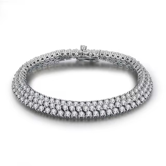 Buying a silver bracelet with Moissanite stone - a luxurious and lasting choice Are you looking for a bracelet with a stylish design and a special and sparkling stone? Our silver bracelets are designed using Moissanite, one of the most brilliant and special gemstones. Every silver bracelet offered in our store offers you a combination of beauty and quality. Moissanite is a synthetic gemstone known for its exceptional brilliance and clarity, making it an excellent alternative to diamonds. The combination of this stone with silver metal creates incredibly beautiful and long-lasting jewelry that is suitable for both everyday use and special occasions. Features of silver bracelets with Moissanite stone: Exceptional Luster: Moissanite has an unparalleled luster due to its extraordinary light reflection. High quality: The silver used in these bracelets is pure and of high quality and is resistant to tarnishing. Various Designs: From classic to modern designs, Moissanite silver bracelets are designed for every taste. Reasonable price: By buying silver bracelets with Moissanite, you can enjoy the beauty and quality of diamonds at a much more reasonable price. Now choose your favorite silver bracelet with Moissanite stone in our store and enjoy special discounts by shopping online. Buying a Moissanite silver bracelet is a choice you will never regret.